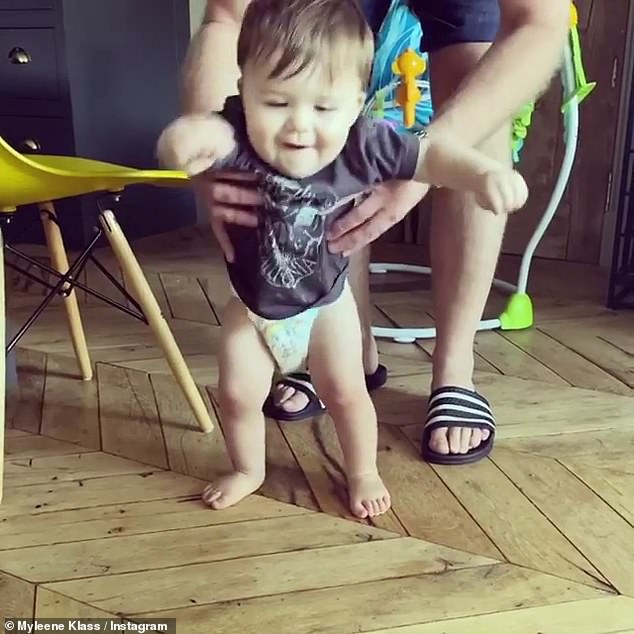 Love: Myleene shared the sweet family clip on her Instagram page, as her partner Simon Motson guided Apollo with his hands as he attempted to take his first steps