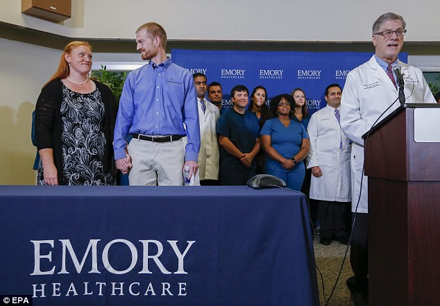 Ebola virus survivor Dr Kent Brantly and his wife, Amber (left) listen to Dr. Bruce Ribner (right), medical director of Emory